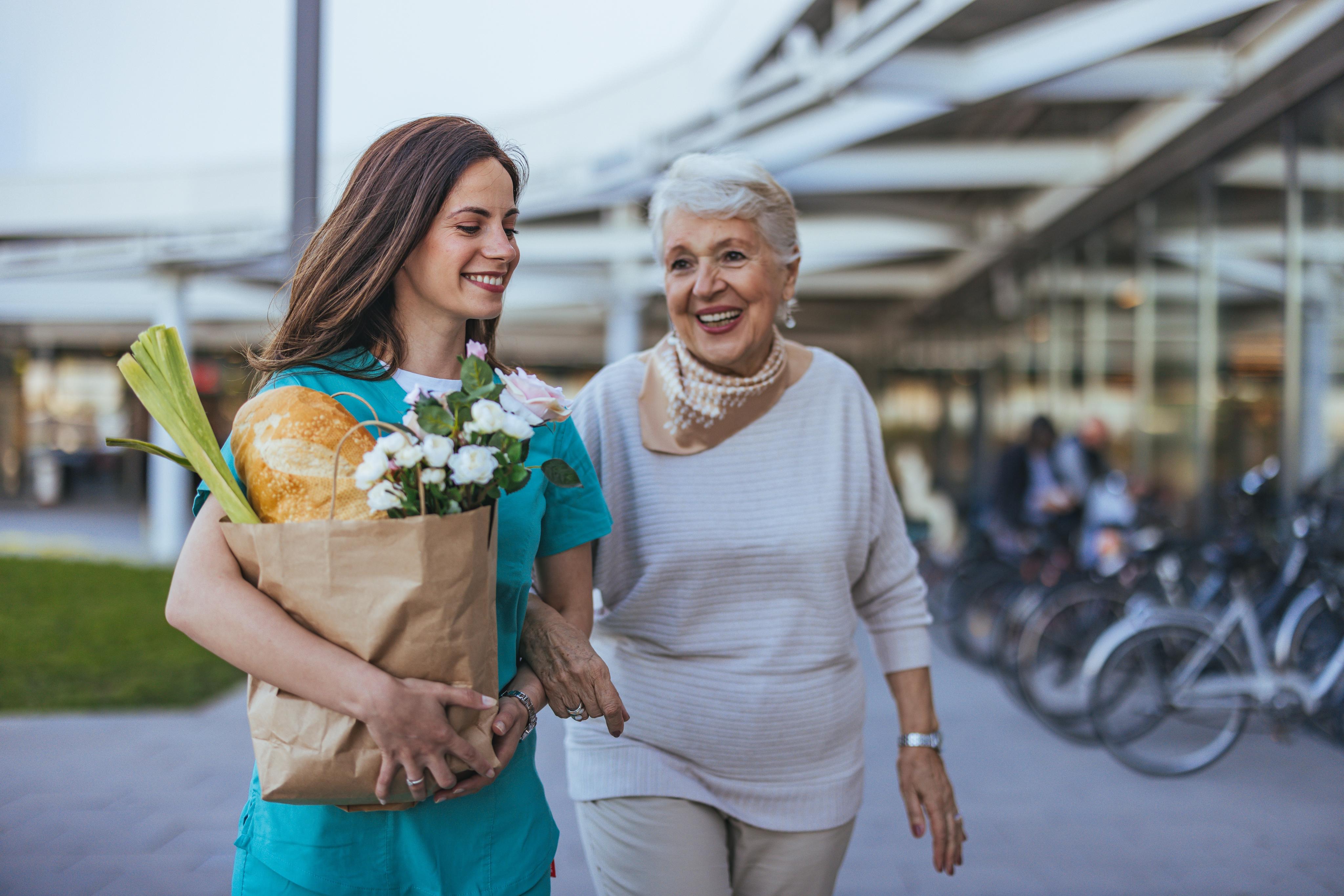 Support worker helping participant with shopping and daily tasks