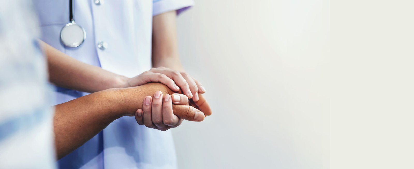 A nurse shaking hands to encourage the patient A nurse shaking hands to encourage the patient
